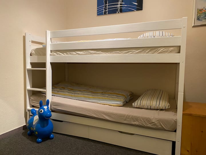 Second, slightly smaller bunk room with bunk bed and lots of toys