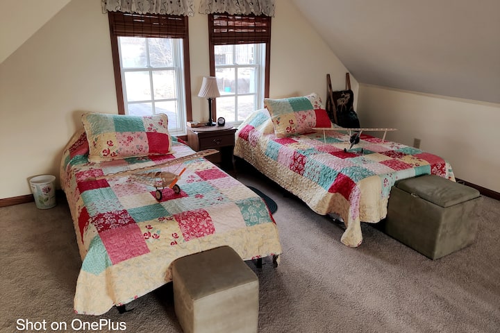 Upstairs, two comfortable twin beds afford a beautiful view of the farm.