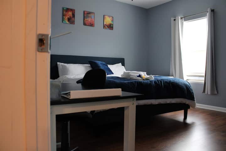 Window view of Bedroom #1 (called the Gryffindor room). Within this king size master bedroom, you will find a desk area, King Size bed, a 42' Small Roku TV, personal coffee maker, coffee, tea and a complimentary bottle of wine.