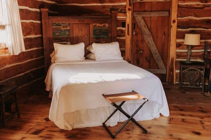 Inside cabin #2, you will find bedroom #4. This oversized bedroom offers a queen bed, desk, sitting space, and storage area. Another perfect room... just steps from our silo bathroom. 