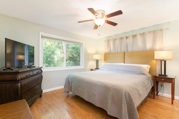 The primary/main bedroom has a comfy king-size bed.