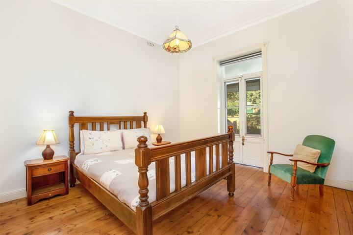 Main bedroom with queen size bed on the raised ground floor.