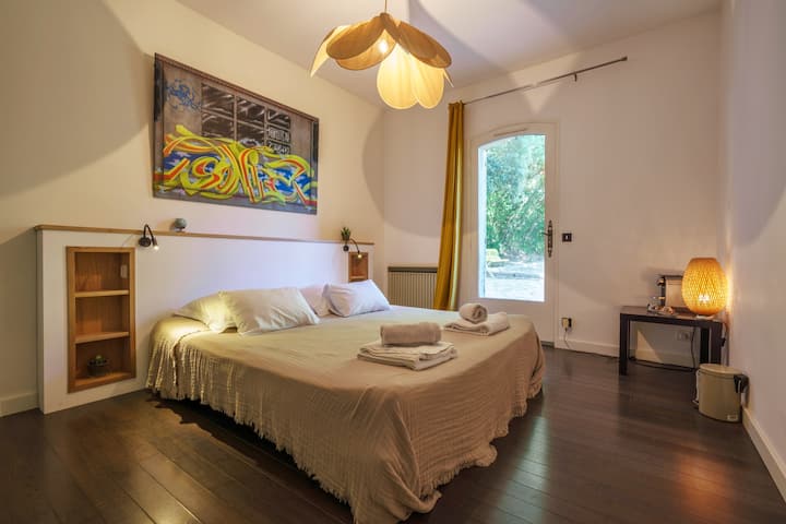 King bed with a smaller italian shower, access to the petanque firld. At the “garden and pool level”