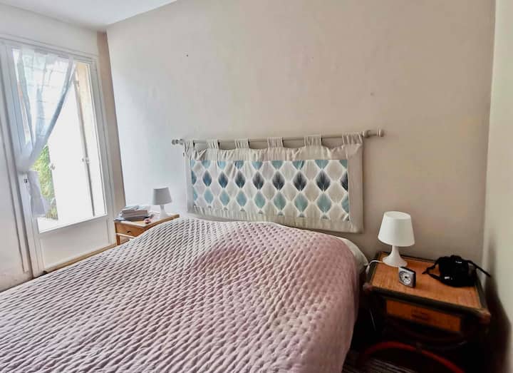 Garden floor: bedroom 2, double bed, open to terrace, attached toilet