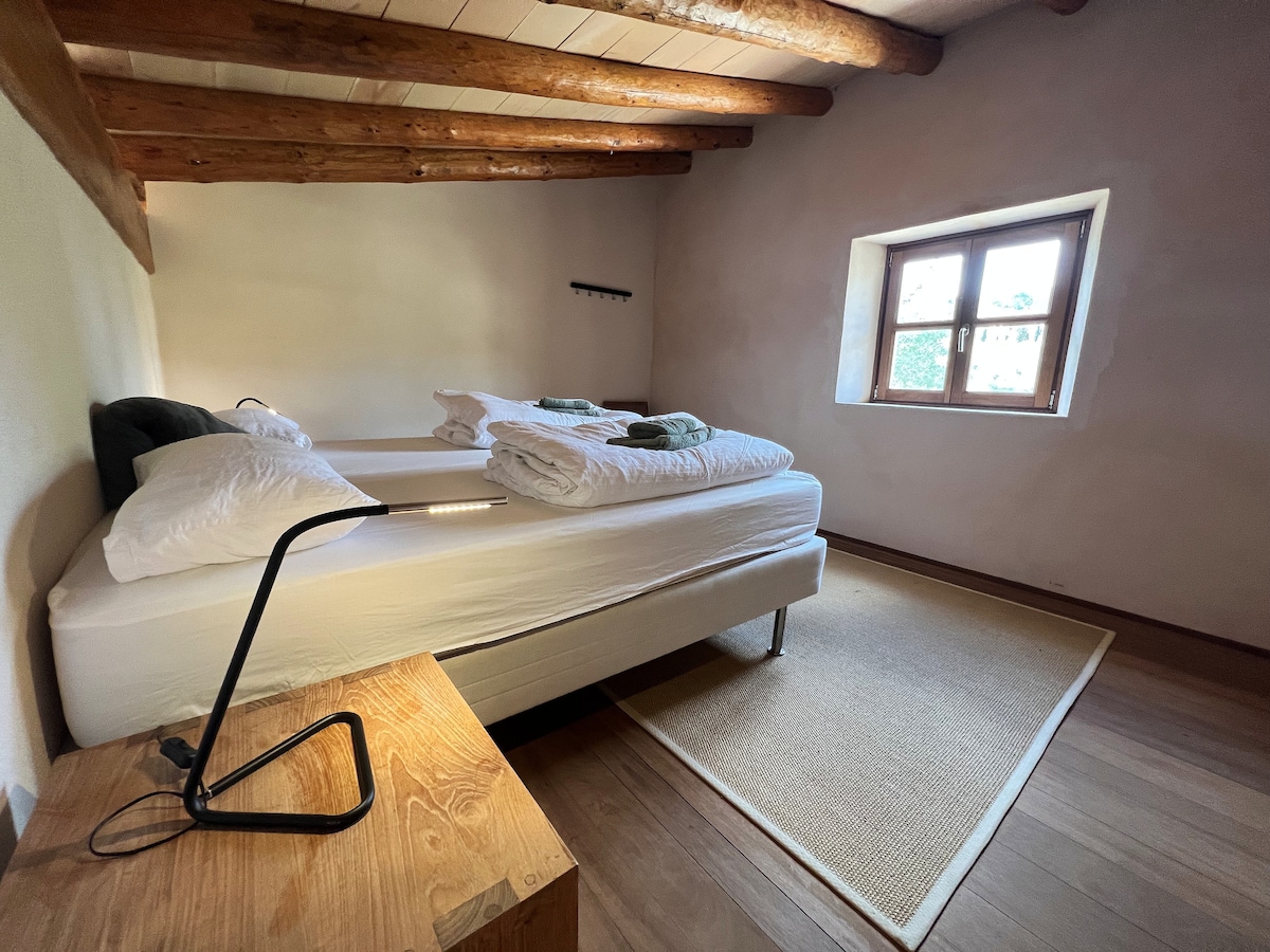 The upper additional bedroom of an ocean view suite with two separate single beds