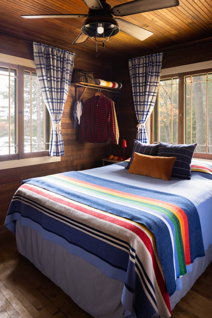 Main floor bedroom with queen bed and lots of cozy wool blankets. 