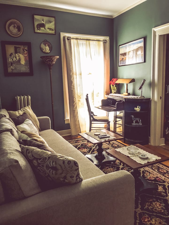 Adjoining sitting room with sleeper sofa and private bath.