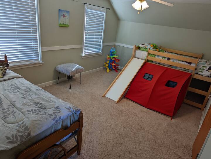 2nd bedroom upstairs features a twin bed and then another up on a fort bunk... Great room for one adult and one child or 2 kiddos!