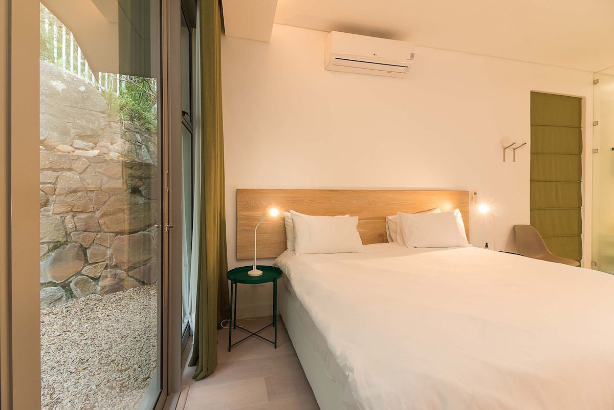 4th bedroom with en suite and sliding door leading outside