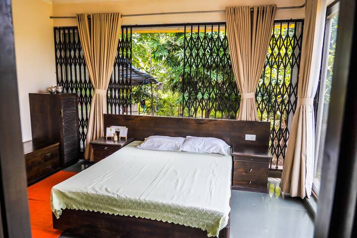 One of our most serene rooms; Garden facing with close proximity to a lush green landscape this room is perfect for meditation and relaxation.  Fitted with a Balcony, Air conditioning and an En-Suite Bathroom and the presence of nature all around you