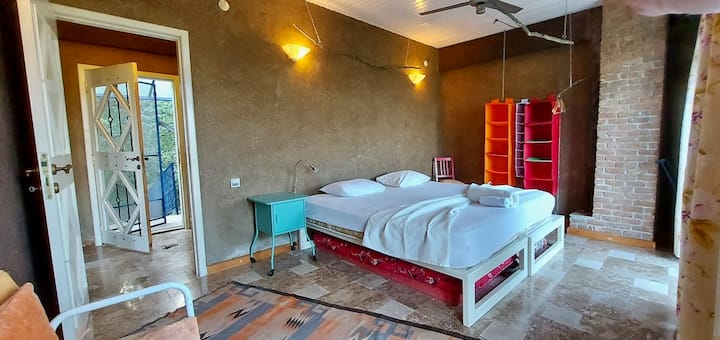 1/4 The double room upstairs has a wide terrace with a superb view of the valley. "This was a perfect place for our 3-day retreat - there were six of us and the place was very comfortable for everyone - secluded." – Artem, guest in 2022.