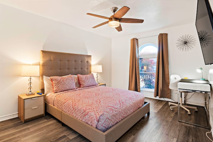 A queen bed with a memory foam mattress in the second guest bedroom, sleep 2. Ceiling fan with remote. Air conditioning. A long desk in the corner as a working area,  50" Samsung Smart HDTV, blackout curtains for a good night sleep.