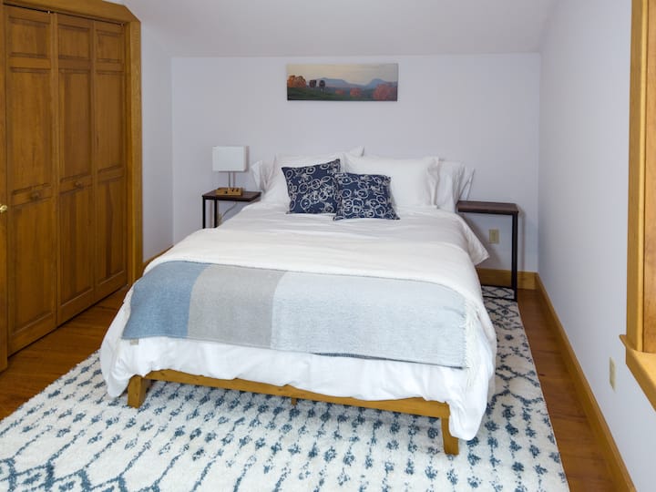 Queen bed. This room also has a adjustable height standing desk that can provide a quiet place for remote work. 