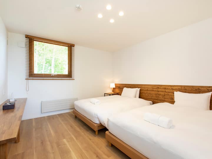 Birchwood Chalet - dizajn spálne pre hostí