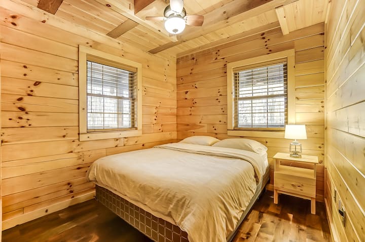 Main floor bedroom #1 with queen bed and closet.