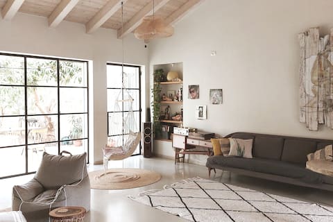 Villa Dahama surrounded by vegetation.