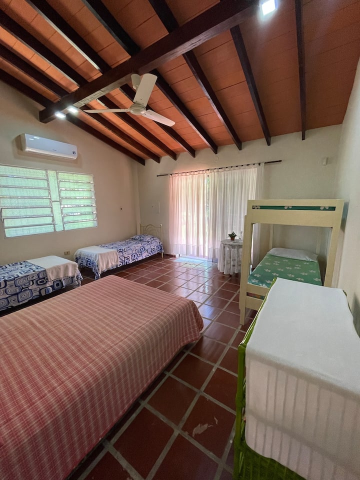 Room 2. Super spacious and with many beds. One queen bed. Two single beds and a bunk bed. Special to stay as a family, see the starry sky and then go to sleep in a clean, comfortable and spacious room
