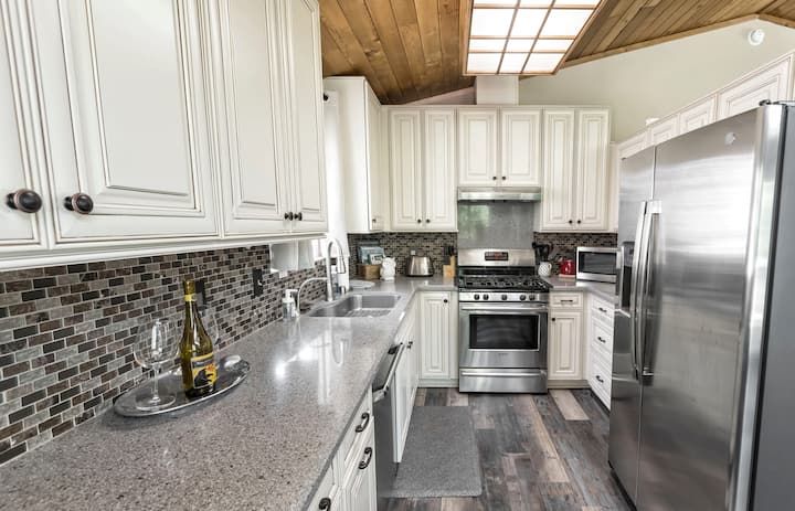 The kitchen has all the modern amenities and comes equipped with all the cookware and dishes your family will need. * Kitchen is located on the 2nd floor