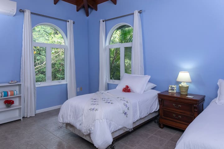 Guest Bedroom with two Twin beds (can be converted to one King bed) with AC 