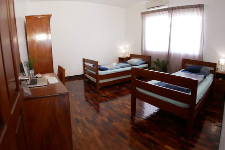 Second bedroom with two big single beds and a pullout bed.
The room has a split type air condition
German: Second bedroom with two large single beds and an extra pull-out bed.
Room has split type air conditioning.