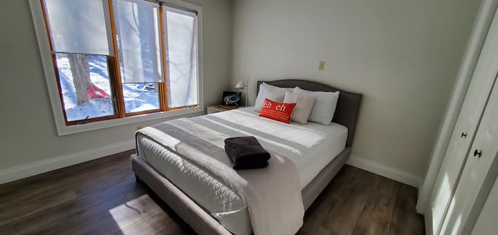 Main floor bedroom with 1 queen bed