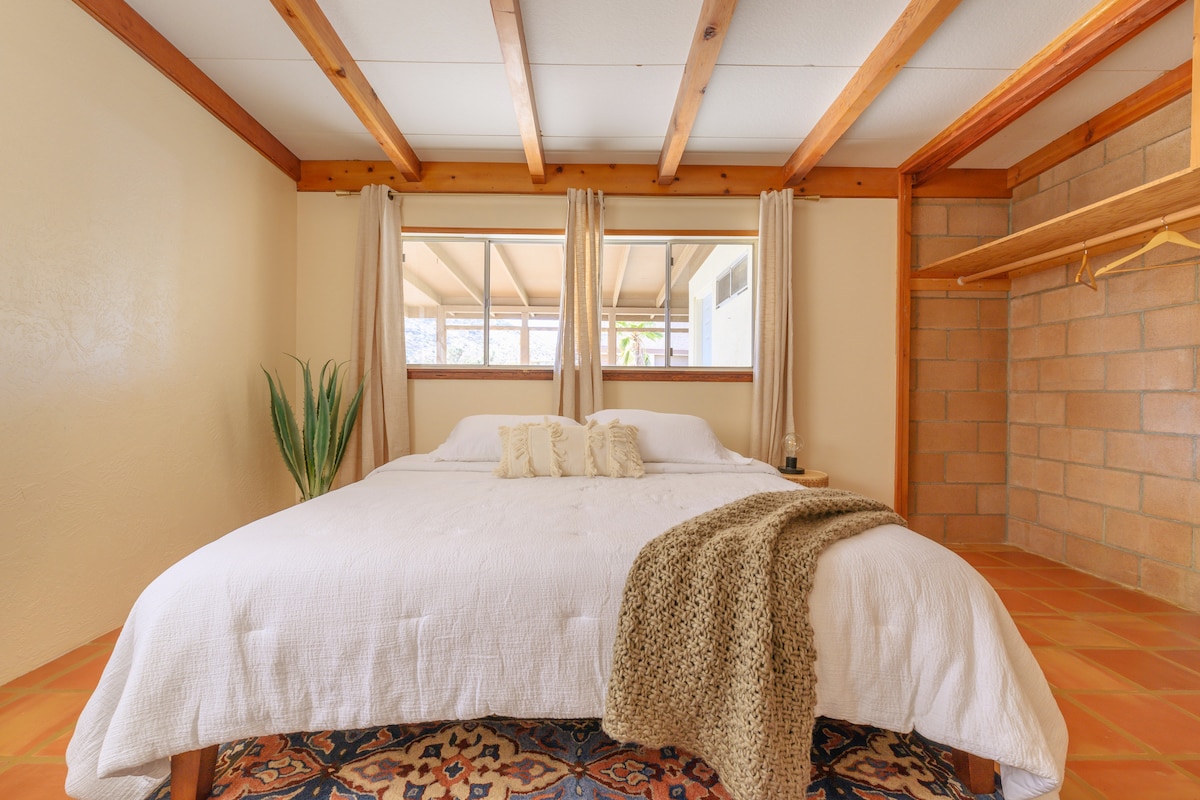 Master bedroom with king size bed, seating and lovely views 