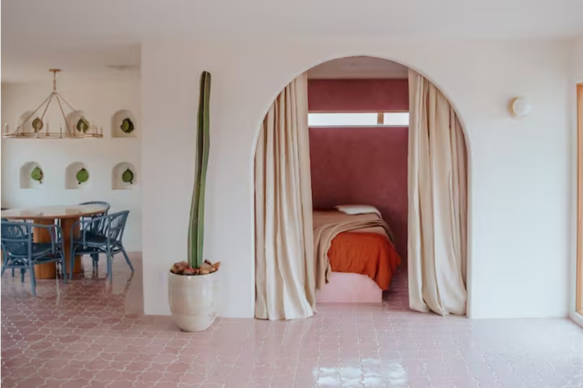 The casita features a living room, dining room, kitchenette and indoor/outdoor bathroom. 