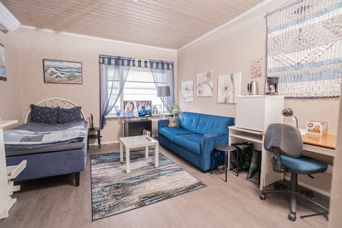 Tranquil Cozy One Room Getaway double bed and sofa