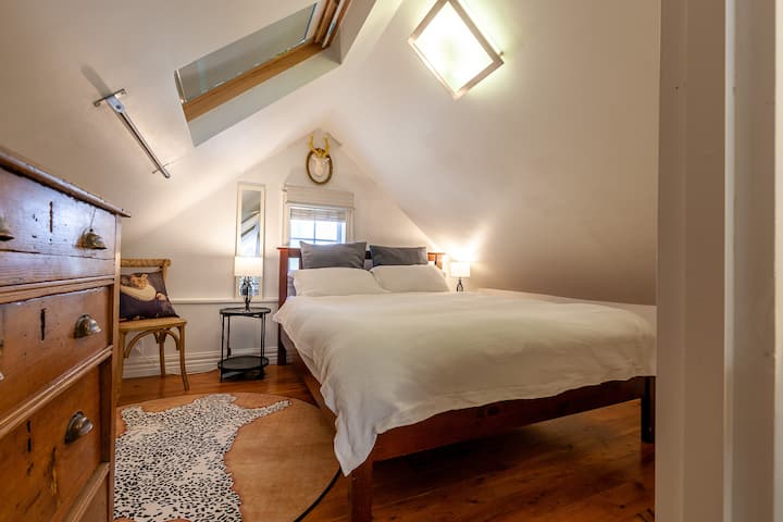 Attic bedroom with queen bed