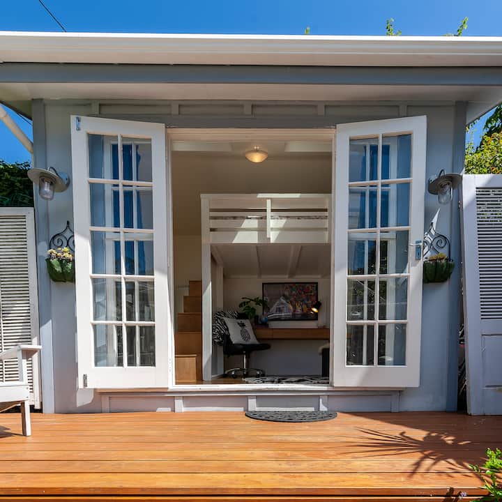 The cottage is on the sunny side of Aro Street. 