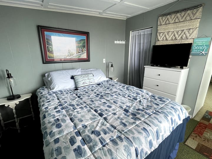 Front view bedroom in the upper duplex. Wake up to a view of the ocean!