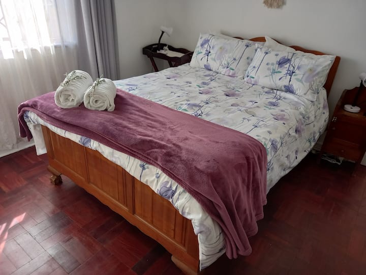 Double bed in main bedroom with electric under-blanket for winter. Extra blankets and pillows available. Bed lamps on both sides, as well as electrical points for other devices and ample built-in cupboards.