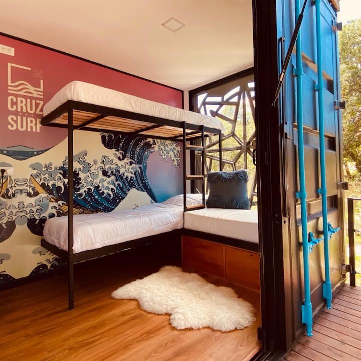 Living room with bunk beds with new and hard mattresses (no cheap springs). An amazing 2x2m window.