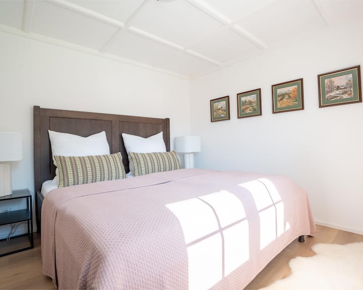 The east-facing bedroom, like the other rooms, is stocked with a cassette ceiling made by the carpenter, providing playful shade at night.