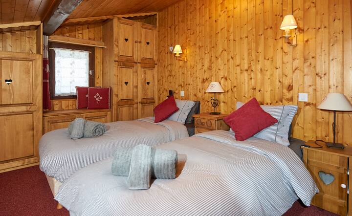 Spacious upstairs double bedroom with masses of cupboard space, set up as a twin in the photo