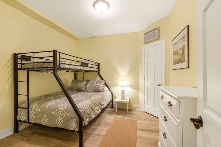 Twin over queen bunk bedroom in lower level is secluded and offers maximum privacy as well as a dedicated air conditioner for your comfort.