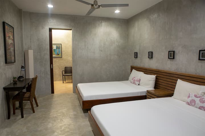 The fourth bedroom with two queen beds.