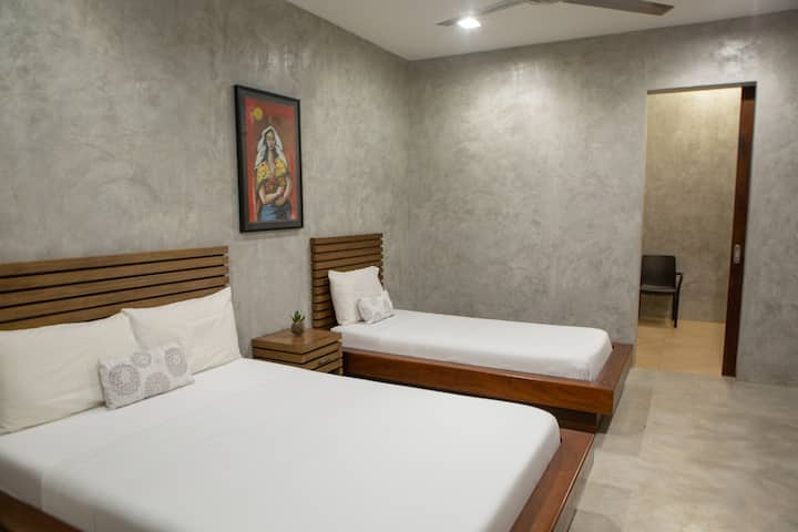 The fifth bedroom with a queen and single bed.