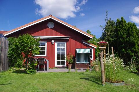 Small red house with garden