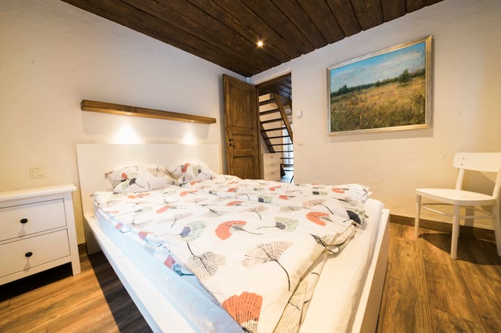 Bedroom with one double bed. There's also a possibility for a baby crib. 