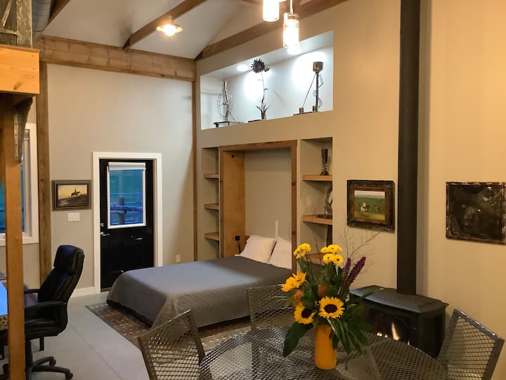Queen Murphy bed across from desk