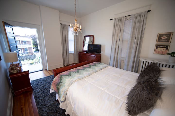 Larger of 2 back queen bedrooms with balcony off them.  Bright room with dish tv! 
Gold lamp is USB CHARGER.