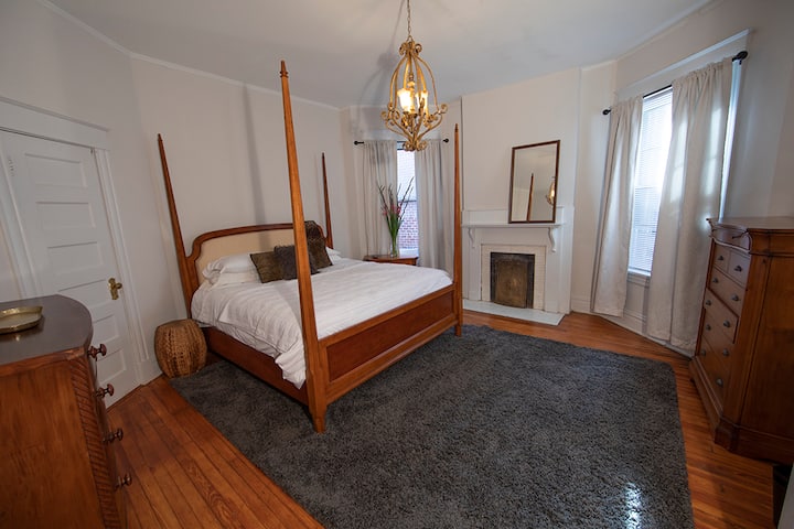 Bright king bed in bedroom 3 upstairs.  2 chest of drawers for your clothes and corner closet. Gold lamp has UBS charger .