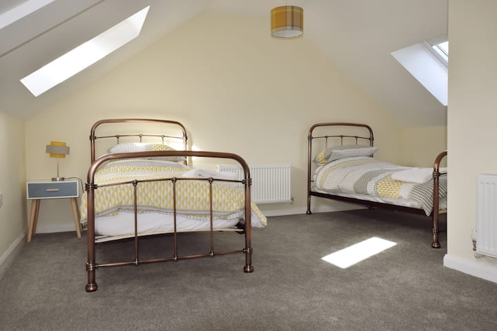 A spacious upstairs twin room.