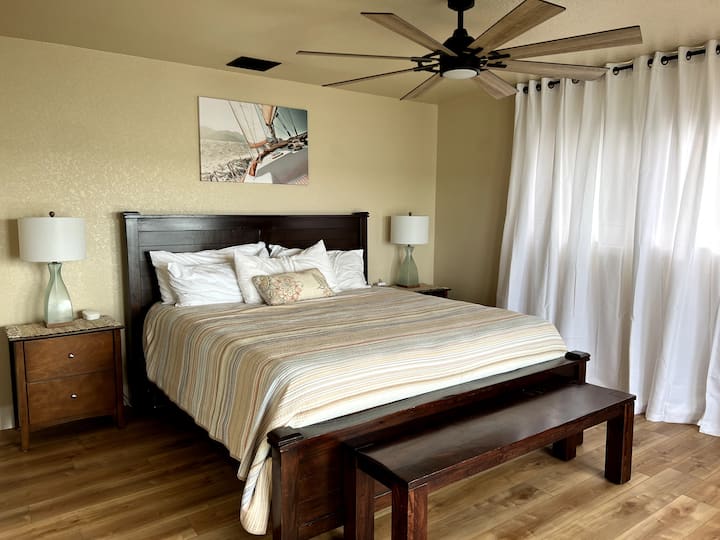 The second-level king bedroom has direct access to the bathroom.
