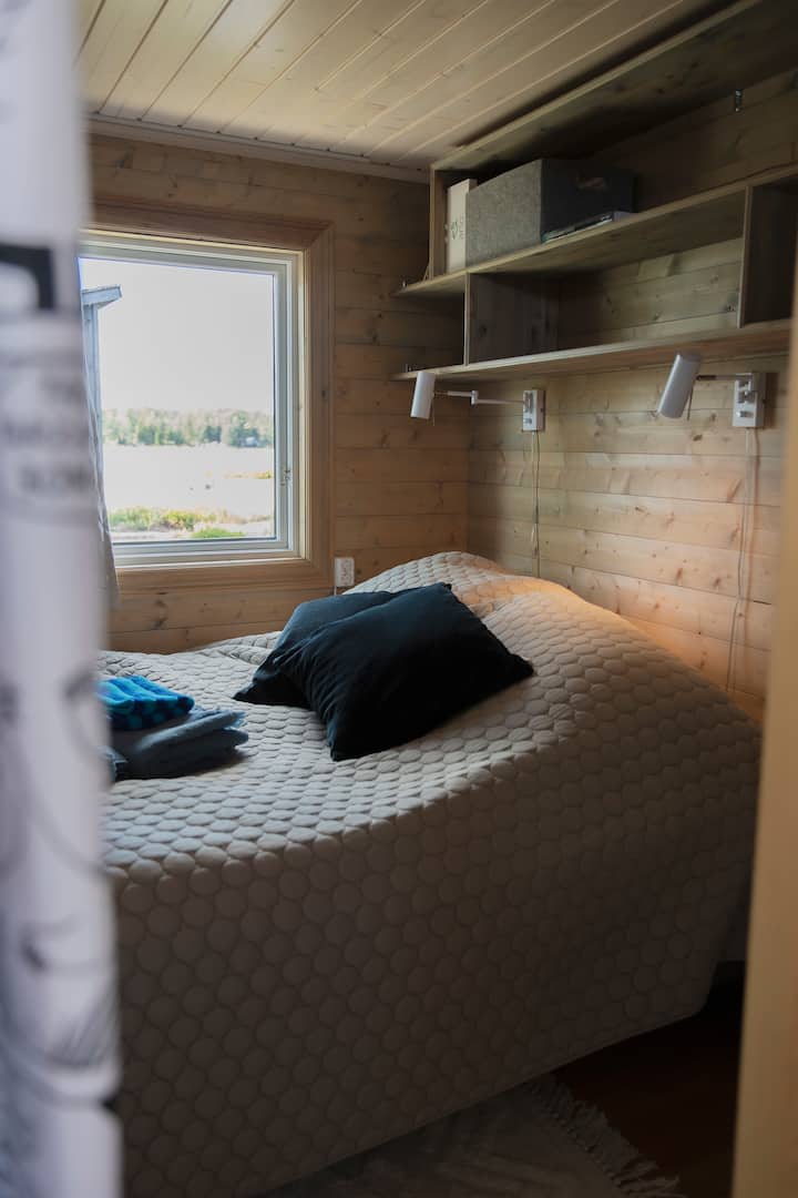 The bedroom. Great reading lights, nice bed waiting for you to make!