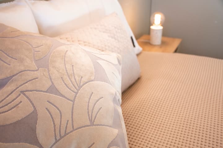 The second bedroom upstairs has a queen bed and a king single bed