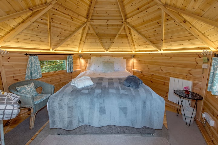 Inside the bedroom lodge is a double bed, a sink, plugs and a heater.