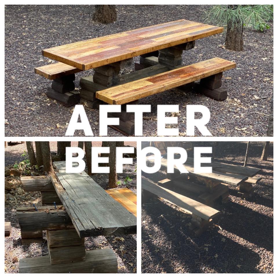 A rustic picnic table and benches are showcased, demonstrating a transformation from weathered wood to a polished surface. Surrounded by natural landscaping, the sturdy table invites outdoor dining and relaxation in a serene environment under the trees.