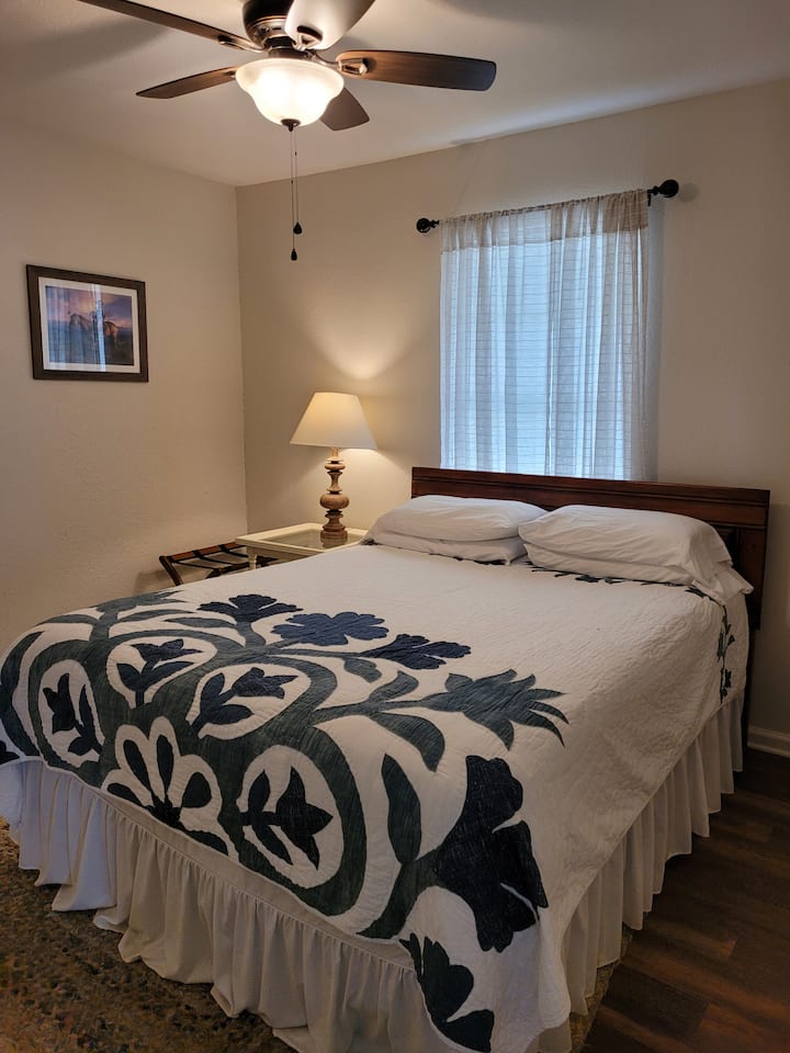 Bedroom with queen-size bed.